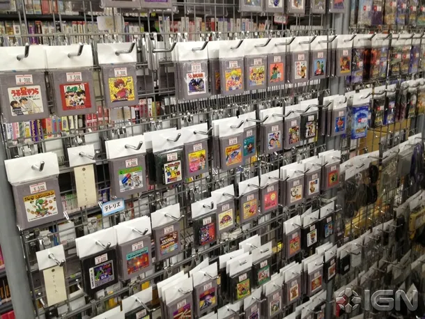 Wall of retro Japanese cartridge games in a Tokyo shop